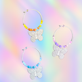 colorful handmade wine glass charms with butterfly charms and beaded rings in yellow orange purple and blue