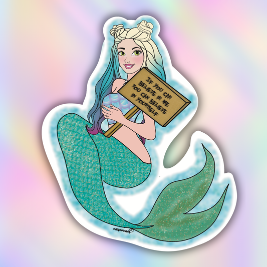 Close-up vinyl sticker of a glittery teal mermaid holding a motivational wooden sign encouraging self-belief